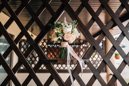 bouquet of a bride on a brown treeの写真素材