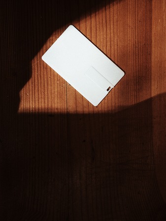 usb flash drive in the form of a credit card, white,の写真素材