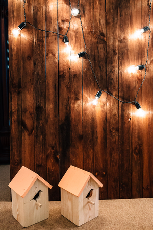 wooden wall, lamp, birdhouseの写真素材