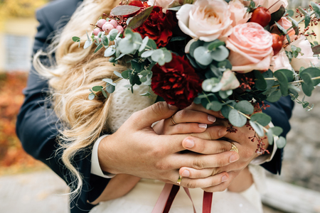 the bridegroom embraces the brideの写真素材