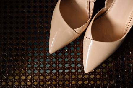 women's beige shoes, brown backgroundの写真素材