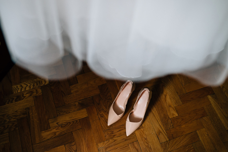 women's beige shoes, brown backgroundの写真素材