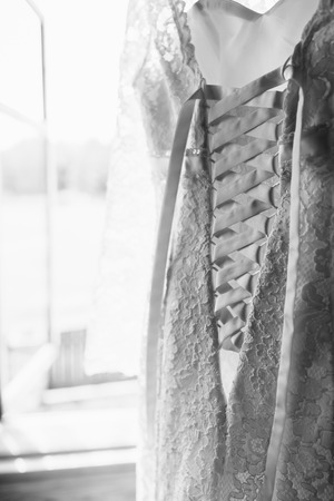 hanging bride's dress, wooden houseの写真素材