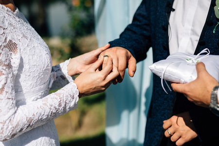 exchange of wedding rings whiteの写真素材