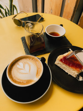 Coffee and Dessert Delight in a Cozy Caf Settingの写真素材