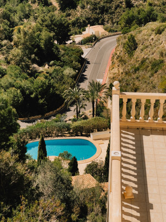 A Beautiful Scenic View Featuring a Pool and a Road, all Surrounded by Lush Natureの写真素材