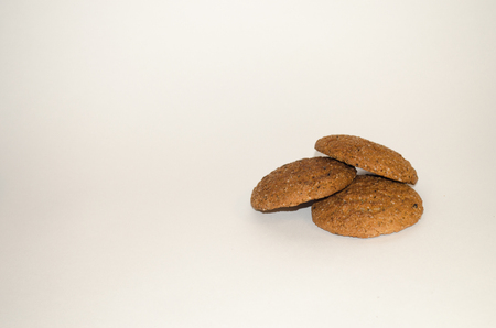 Fresh oatmeal cookies on a white background