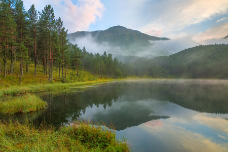 Foggy day at mountain lake
