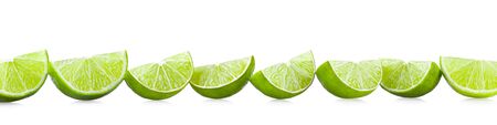 Ripe lime slices isolated on white backgroundの写真素材