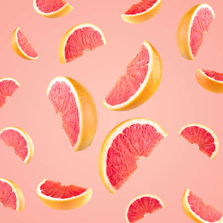 Falling grapefruit slices as a backgroundの写真素材
