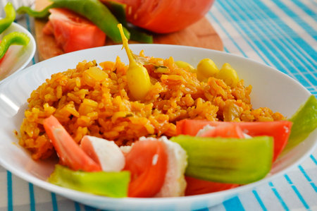 Fried rice with vegetables on a plate. Close-up.の写真素材