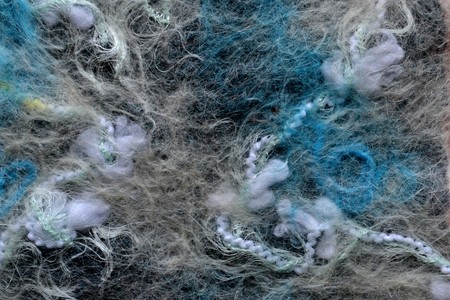 bright blue wool fibers bound with gray cloth