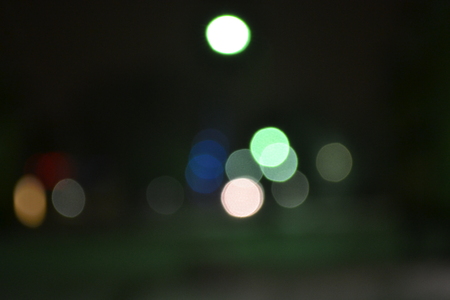 winter dark night glow and shimmer with colored lightsの写真素材