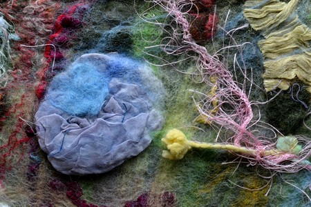 Compressed blue silk with colored matted locks in soft fabric