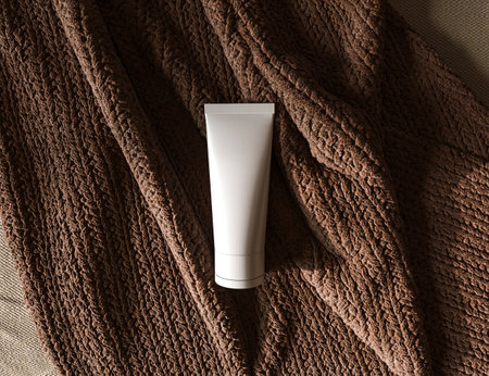 Natural cosmetic product podium display. Brand presentation. Cream on brown rag cloth of background. 3d rendering illustration.の写真素材
