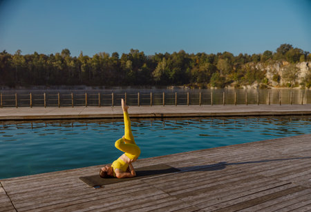 Yoga Practice by the Water Discover Serenity and Balance Surrounded by Natures Beautyの写真素材