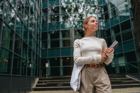 An Empowered and Confident Businesswoman Thriving in a Contemporary Urban Environmentの写真素材