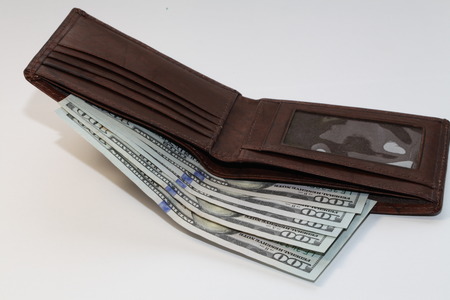 bunch of the new one hundred dollar bills and walletの写真素材