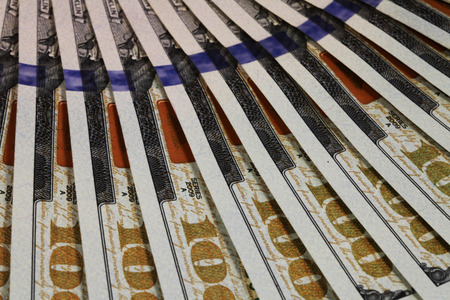 close view of one hundred dollar billsの写真素材