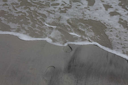 Footprint on sandy beach