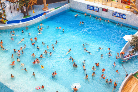 Wave pool in the water park. Numerous visitors swimming in the pool.のeditorial素材