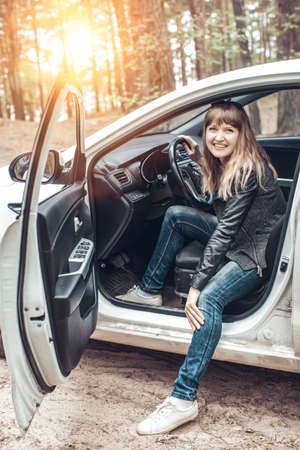 The face of a cheerful girl half hidden by hairの写真素材