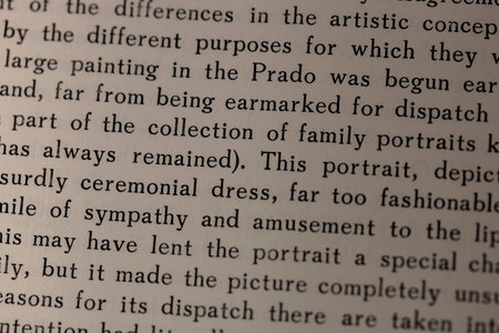 macro photography of a book page with English text, an open book page under artificial light