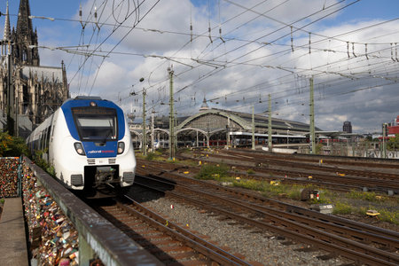 The train traveling to the Cologne central station near the Hohenzollern bridge