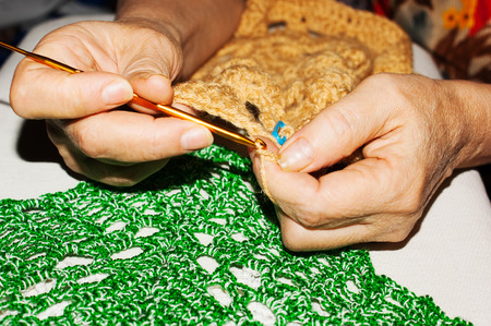 The woman knits crochet close upの写真素材