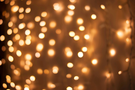 Christmas lights golden bokeh backgroundの写真素材
