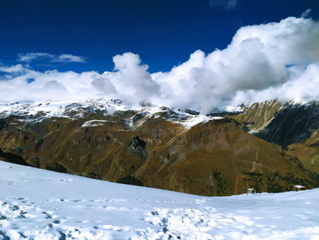 Mountain landscape with snow and clear blue sky. Caucasus Mountains