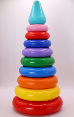 Pyramid of colored plastic rings on a white background. Toys for children.の写真素材