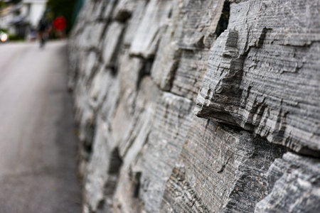 Close up of a stone wall in a street in the city.の写真素材