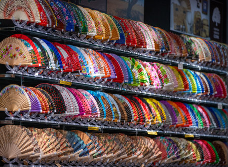 A colorful display of traditional Spanish abanicos, hand fans in a souvenir shop in Palma de Mallorca.の写真素材