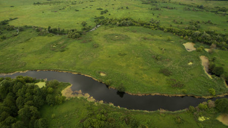 Landscape of a meandering river aerial surveyの写真素材