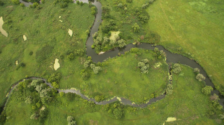 Landscape of a meandering river aerial surveyの写真素材