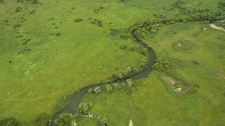Landscape of a meandering river aerial surveyの写真素材