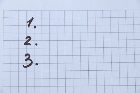 sheet of white squared paper with numbers 123の写真素材