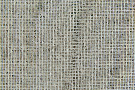 dust on the protective mesh of the air conditioner as a background macroの写真素材