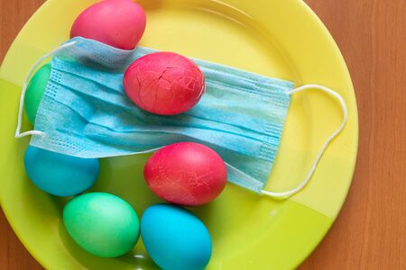 medical mask and on it lies an Easter egg for Easter duringの写真素材