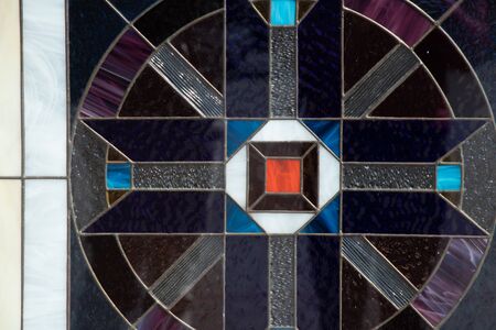 mosaic on a window in a christian church as backgroundの写真素材