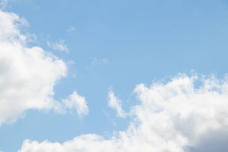 cloudy sky on a sunny day as a backgroundの写真素材