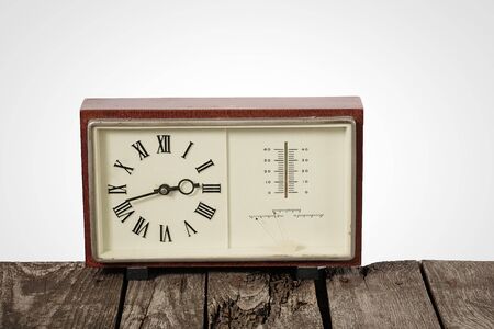 soviet table clock in a wooden frame lie on the table