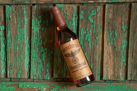 Ukraine, Dnipro - April 05, 2020. horneburger 1939 whiskey of the third reich found in the cellar lies on the tableのeditorial素材