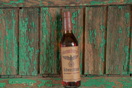 Ukraine, Dnipro - April 05, 2020. horneburger 1939 whiskey of the third reich found in the cellar lies on the tableのeditorial素材