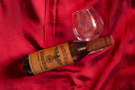 Ukraine, Dnipro - April 05, 2020. horneburger 1939 whiskey of the third reich found in the cellar lies on the tableのeditorial素材