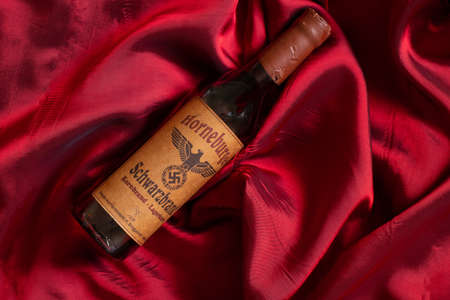 Ukraine, Dnipro - April 05, 2020. horneburger 1939 whiskey of the third reich found in the cellar lies on the tableのeditorial素材