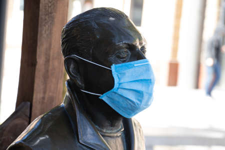 Ukraine, Dnipro - May 13, 2020. monument in the Dnieper in the square businessman Gennady Axelrod in the Medetsyn mask during the covid-19 pandemicのeditorial素材