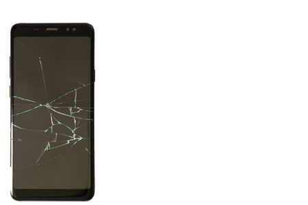 black phone with cracked screen on an isolated backgroundの写真素材