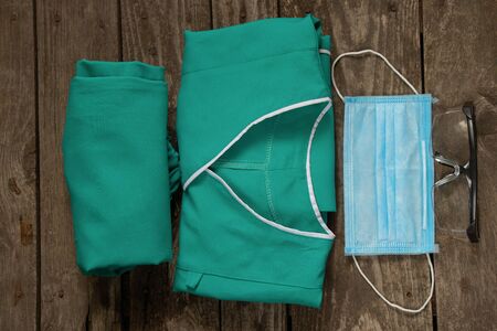 medical uniform set folded on an isolated background nurseの写真素材